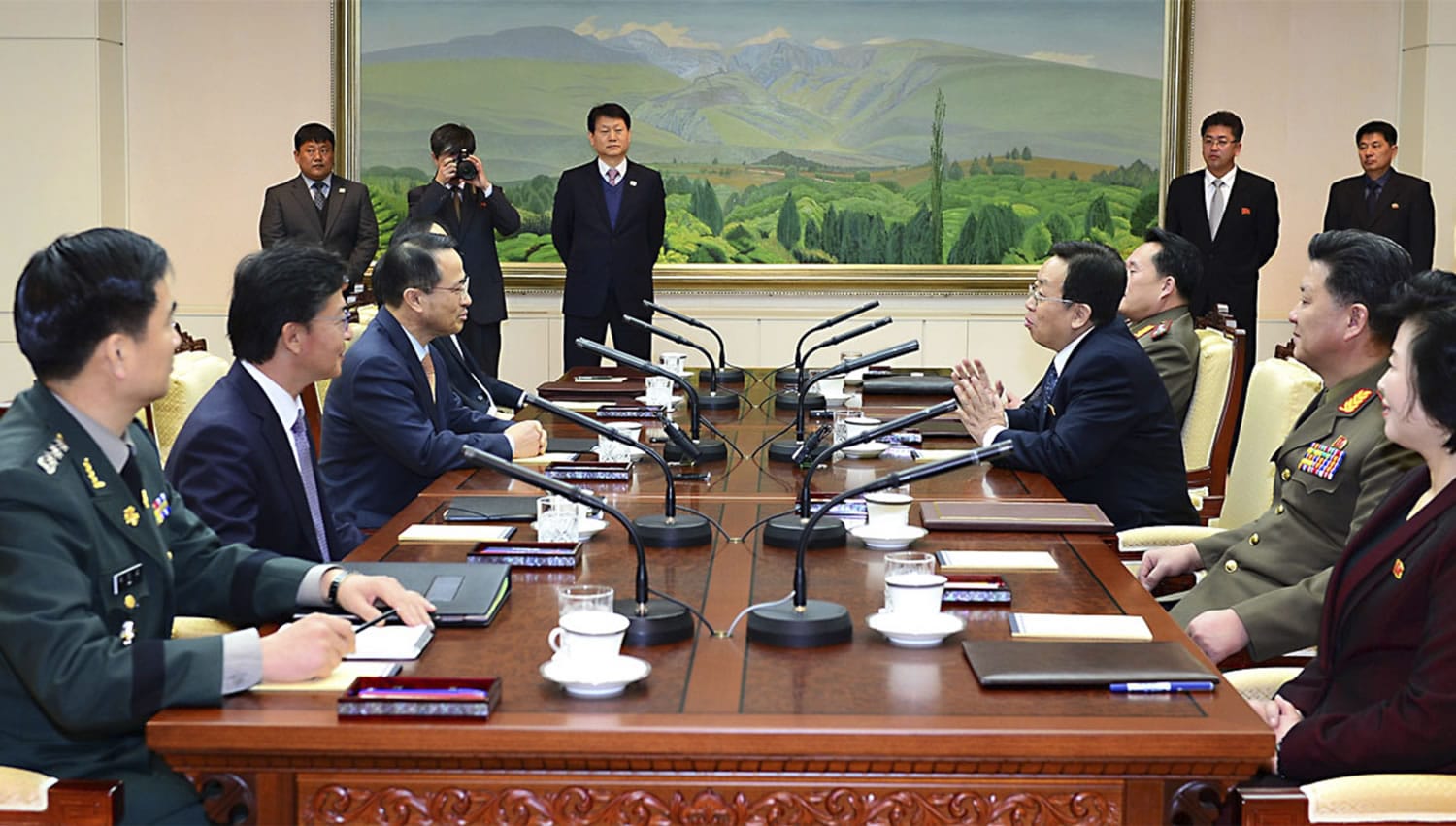 South Korean Unification Ministry
South Korean chief delegate Kim Kyou-hyun, third from left, talks with his North Korean counterpart Won Tong Yon, third from right, during a meeting Friday in the border village of Panumjom, South Korea.