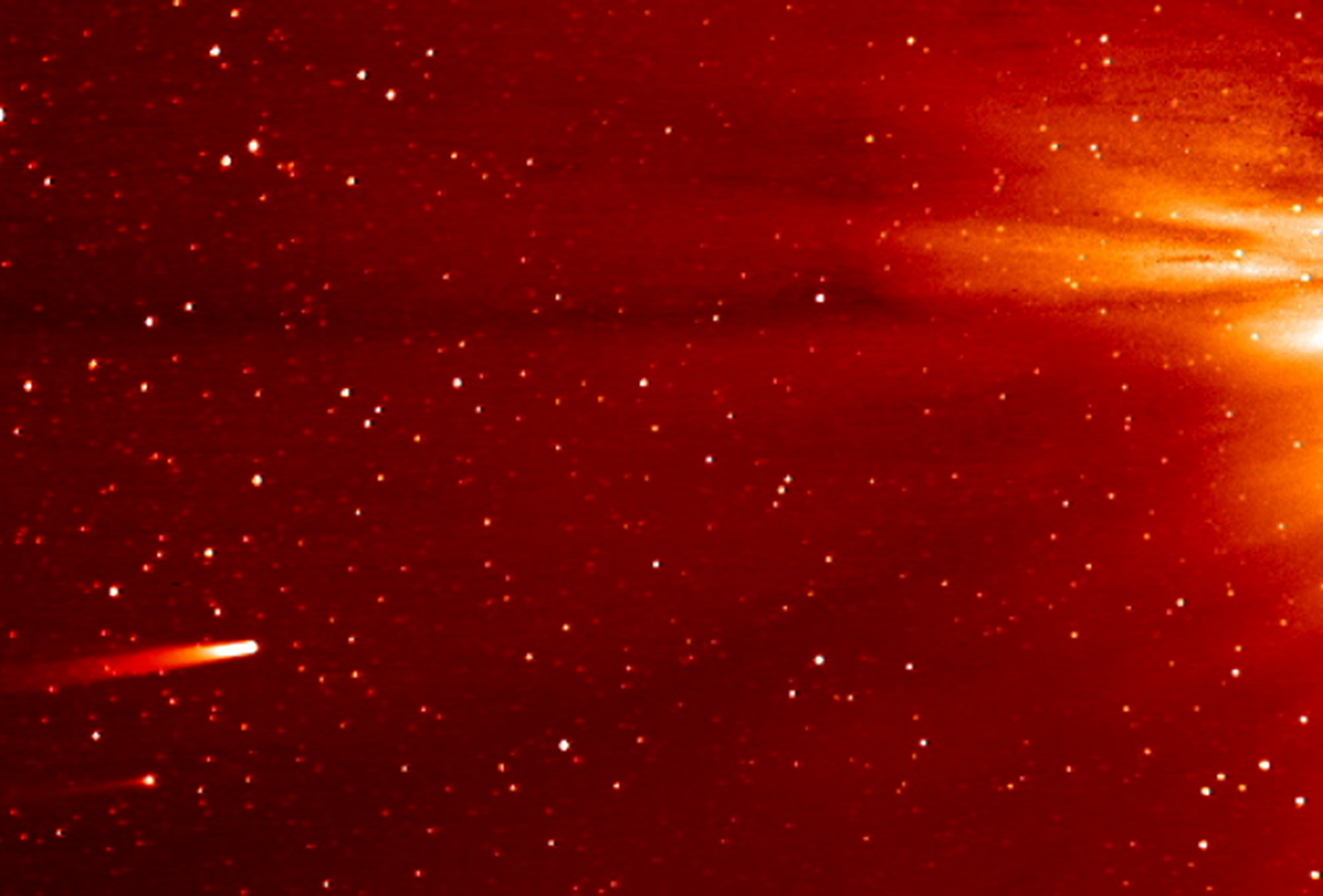 NASA
In this image from enhanced video made by NASA's STEREO-A spacecraft, comet ISON, at lower left, approaches the sun Monday. Comet Encke is seen just below ISON.