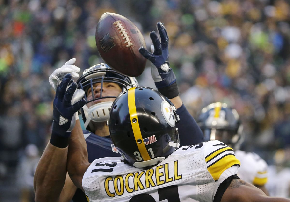 Seattle Seahawks' Jimmy Graham, top, makes a catch over Pittsburgh Steelers' Ross Cockrell (31) in the second half of an NFL football game, Sunday, Nov. 29, 2015, in Seattle. (AP Photo/Ted S.