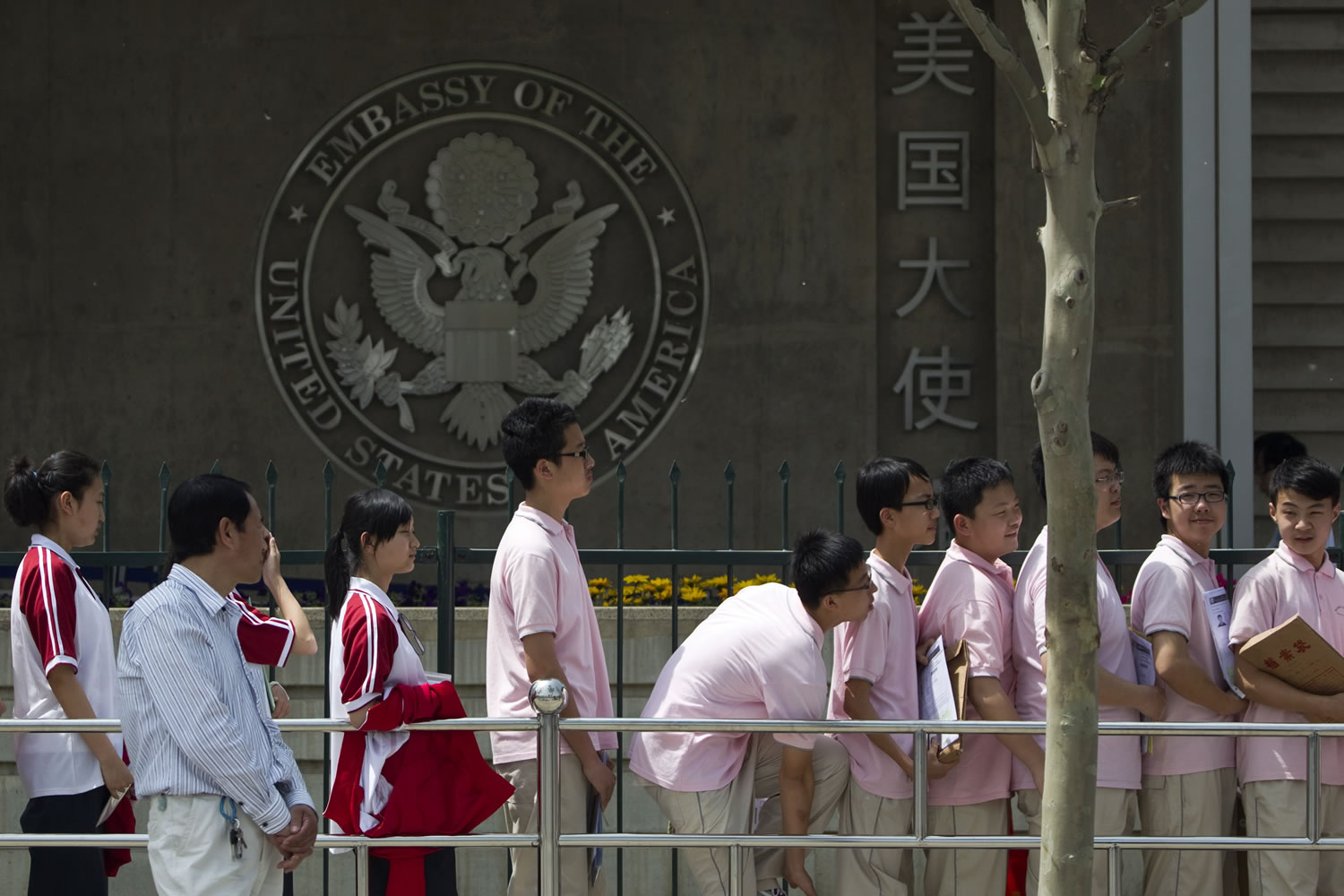 Chinese students wait outside the U.S.