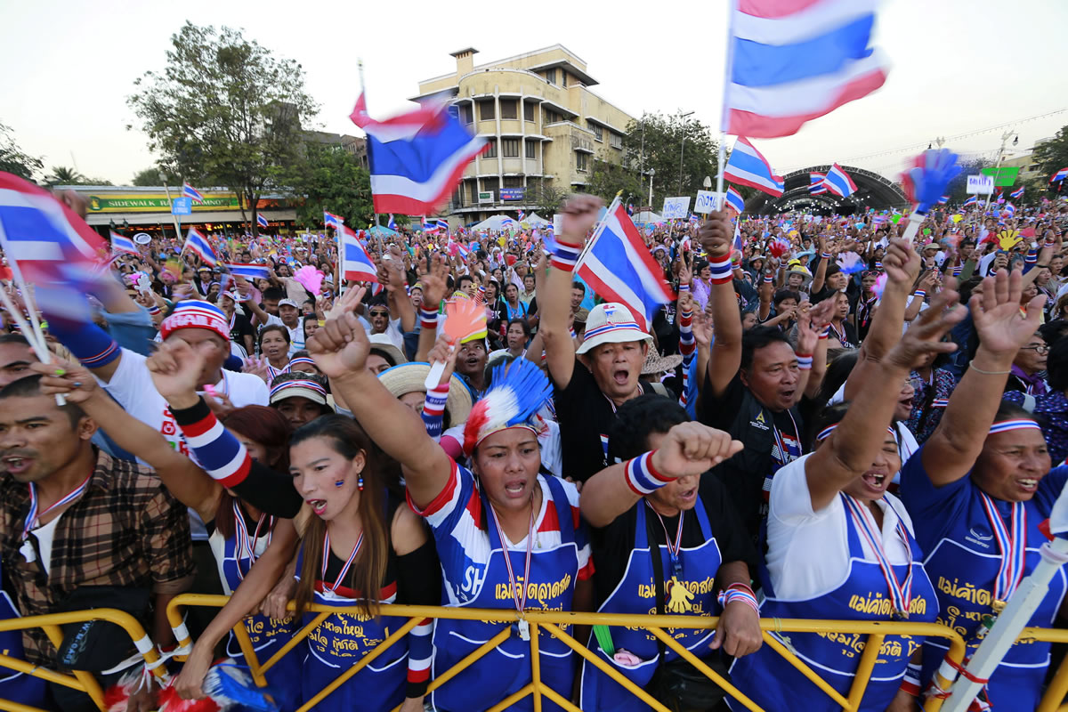 Thai anti-government protesters shout and cheer during a rally at the Democracy Monument in Bangkok, Sunday.