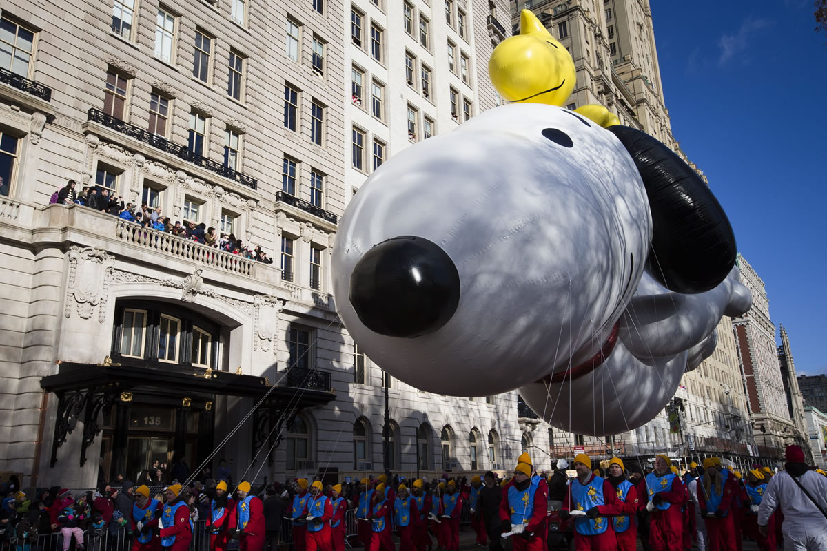 The Snoopy balloon passes spectators during the Macy's Thanksgiving Day Parade on Thursday in New York.