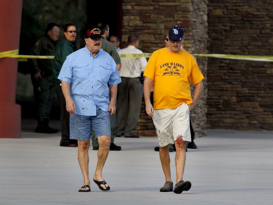 Charles Cummings, 68, left, and his son, Alex Cummings, 34, witnessed the shooting inside the Cobb Grove 16 theater in Wesley Chapel, Fla., on Monday.