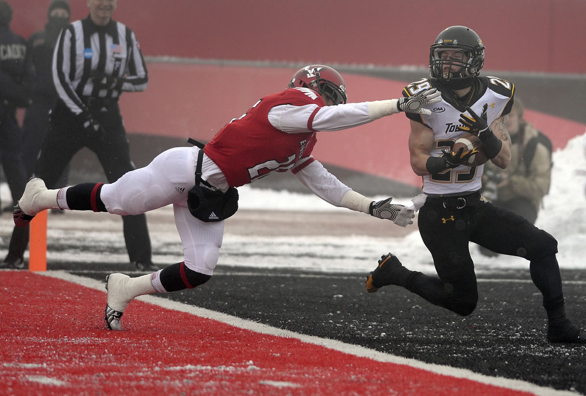 Towson Tigers wide receiver Brian Dowling (29) makes a touchdown reception as Eastern Washington  defensive back Miles Weatheroy, left, comes up short during the first half of the FCS  semifinals at Roos Field, Saturday.