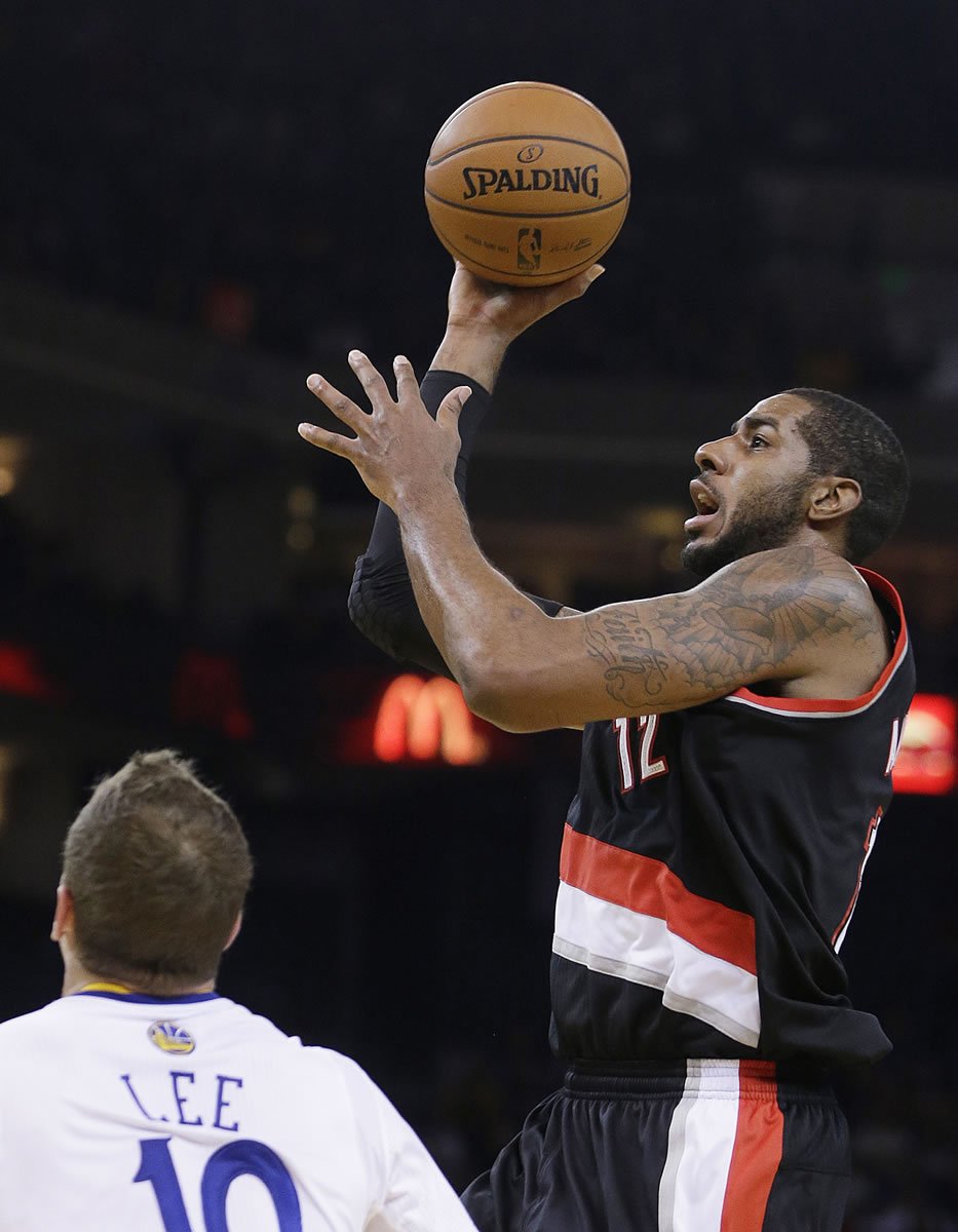 Portland Trail Blazers' LaMarcus Aldridge (12) shoots over Golden State Warriors' David Lee during the first half of an NBA basketball game Saturday, Nov. 23, 2013, in Oakland, Calif.