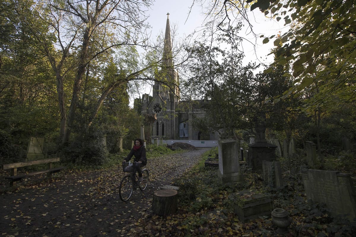 A cyclist rides through Abney Park in London earlier this month.