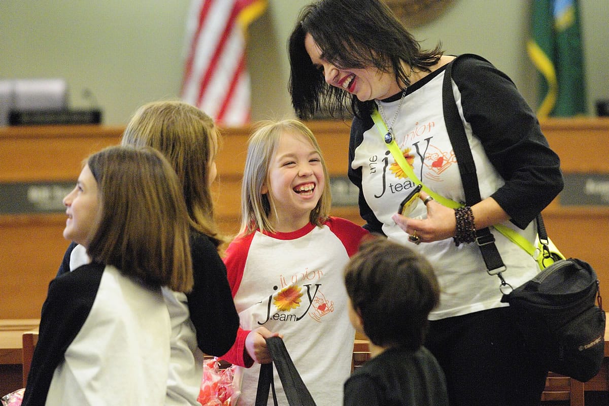 West Minnehaha: Michele Larsen, right, laughs with her daughter Taryn during a Junior Joy Team visit last year to Vancouver city council chambers.