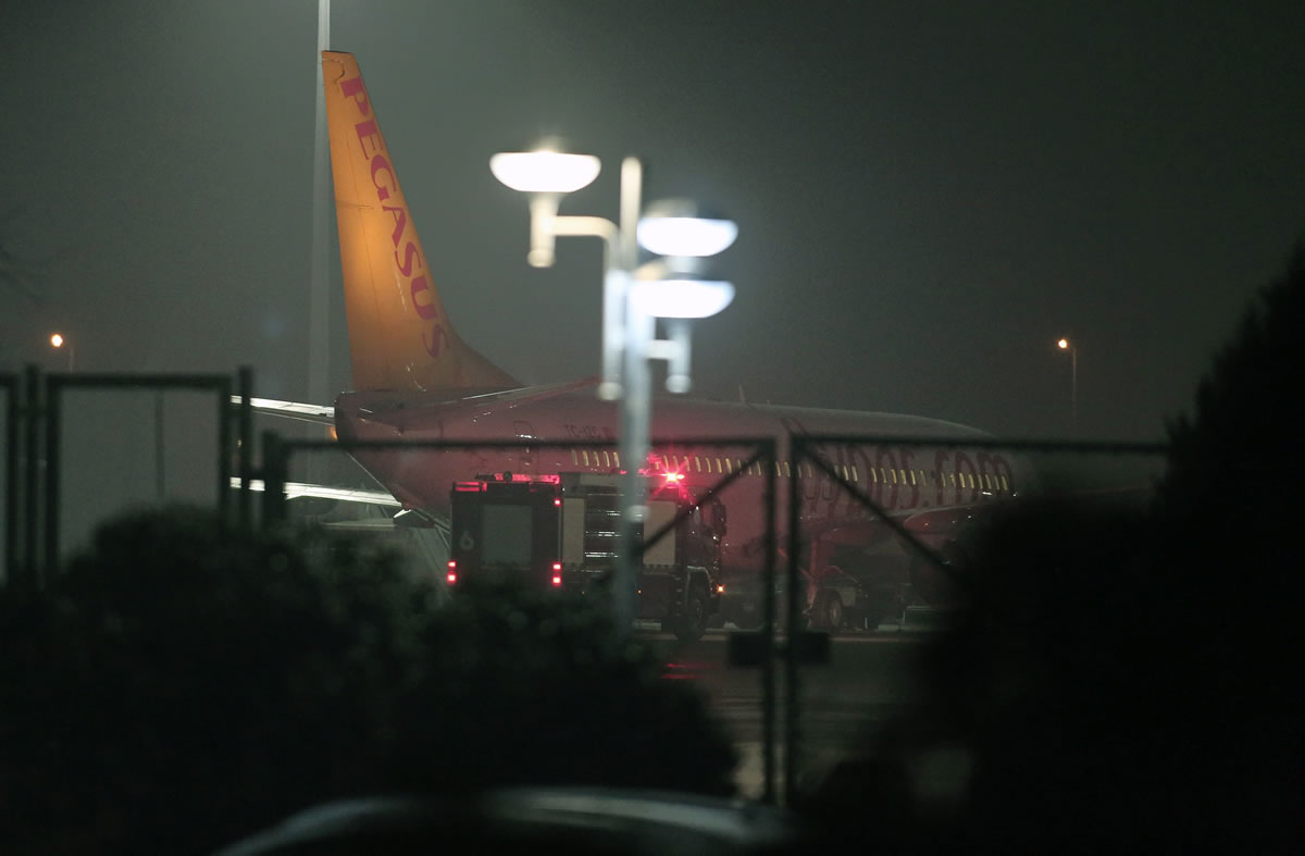 Turkish private company Pegasus passenger plane at the Sabiha Gokcen Airport in Istanbul, Turkey, on Friday, after a Ukrainian passenger on board Istanbul-bound flight claimed there was a bomb on board and tried to hijack the plane to Sochi, Russia, where the winter Olympics are kicking off, an official said.