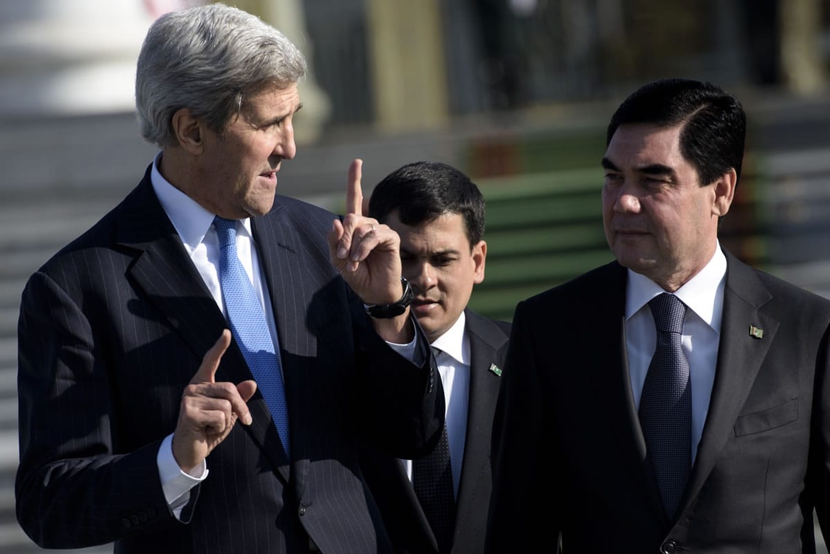 U.S. Secretary of State John Kerry, left, and Turkmen President Gurbanguly Berdimuhamedov speak as they leave after a meeting at the Oguzkhan Presidential Palace in Ashgabat, Turkmenistan. Kerry is traveling to Tajikistan and Turkmenistan on the last day of his travels in the region as he visits five Central Asian nations.