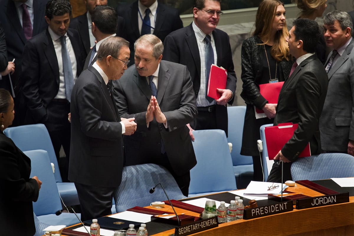 Jordanian Foreign Minister and President of the United Nations Security Council Nasser Judeh, right, has a conversation with U.N. Secretary-General Ban Ki-moon as the Security Council meeting began at U.N. headquarters, Monday, Jan. 20, 2014.  Ban says &quot;intensive and urgent discussions are under way&quot; around his invitation for Iran to join this week's peace talks on Syria.