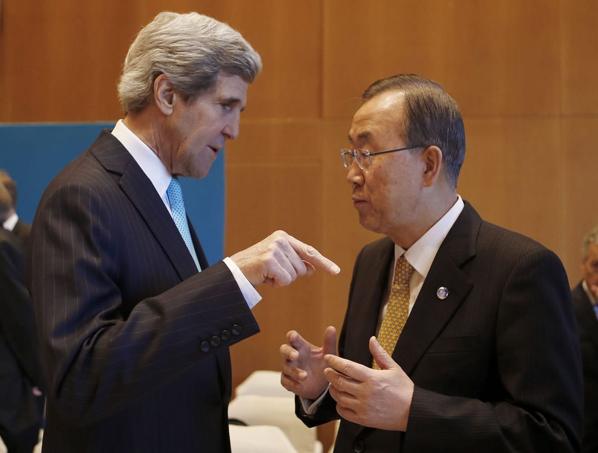 U.S. Secretary of State John Kerry, left, talks to U.N.