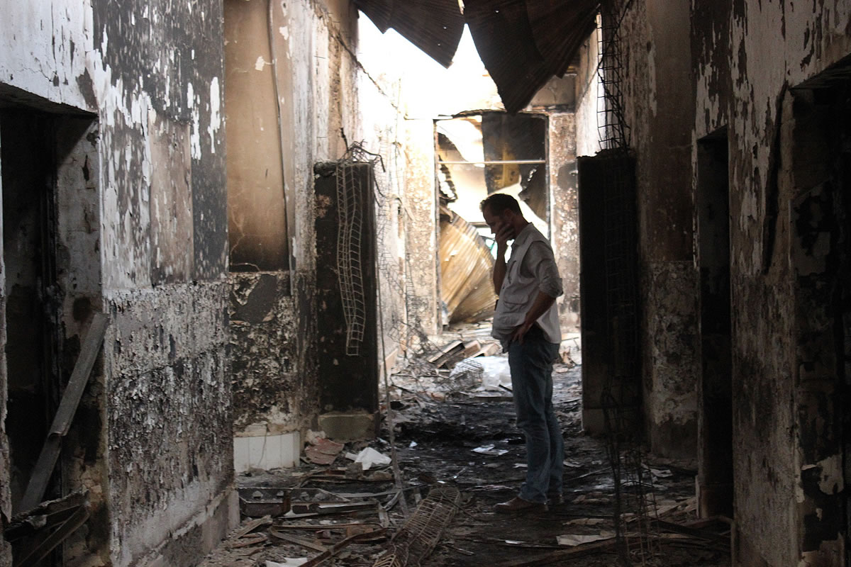 An employee of Doctors Without Borders walks inside the charred remains of their hospital after it was hit by a U.S. airstrike in Kunduz, Afghanistan, in October. An investigative report on the U.S. air attack that killed more than two dozen civilians at a medical charity&#039;s hospital in northern Afghanistan last month says the crew of the attacking plane misidentified the target, believing it to be a government compound taken over by the Taliban.