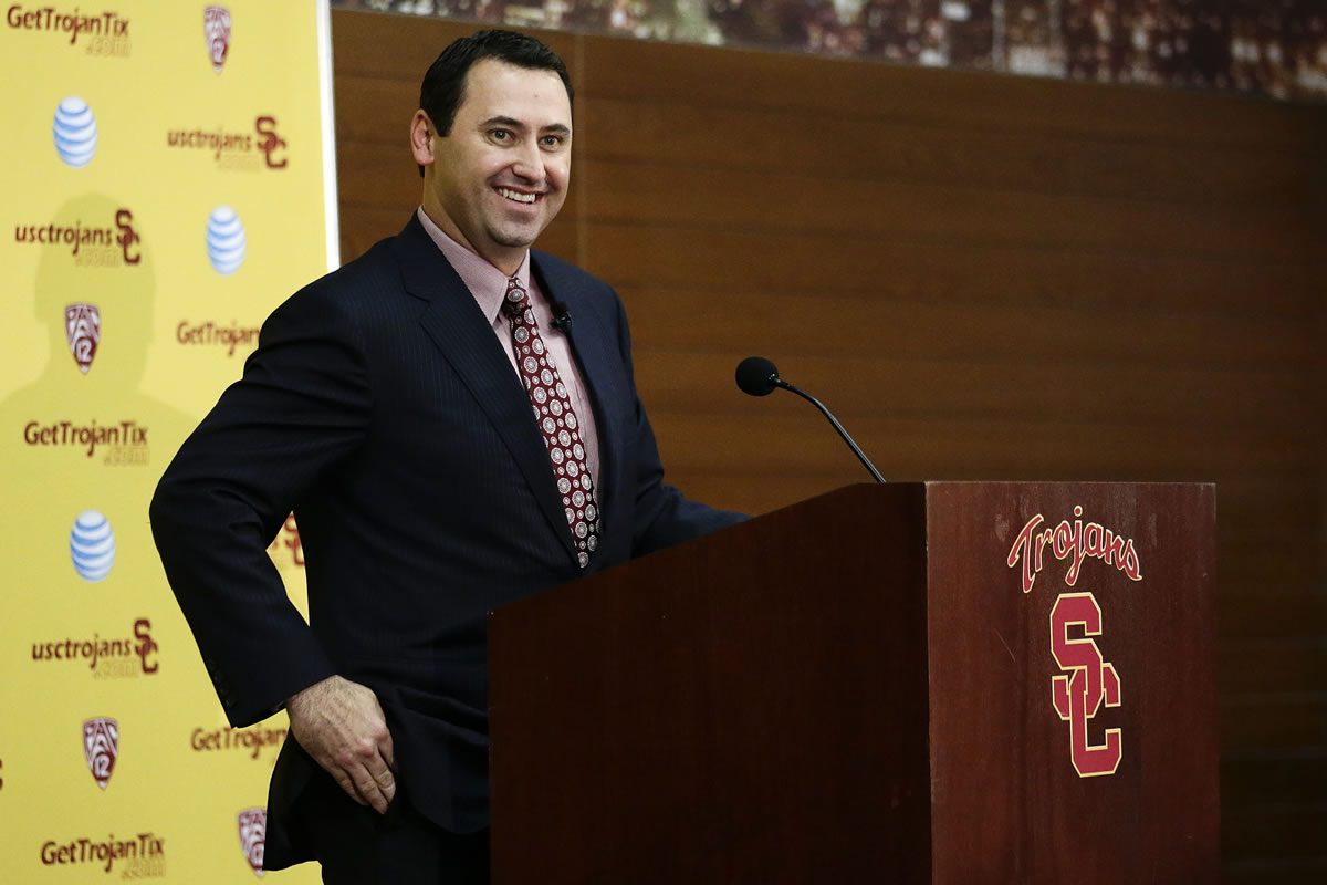 New Southern California football head coach Steve Sarkisian smiles while talking to reporters during a news conference on Tuesday in Los Angeles.