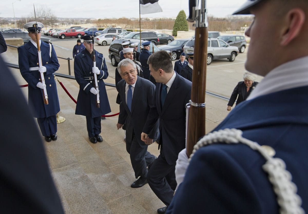 Defense Secretary Chuck Hagel, left, hosts an honor cordon to welcome Estonia's Defense Urmas Reinsalu at the Pentagon on Monday.