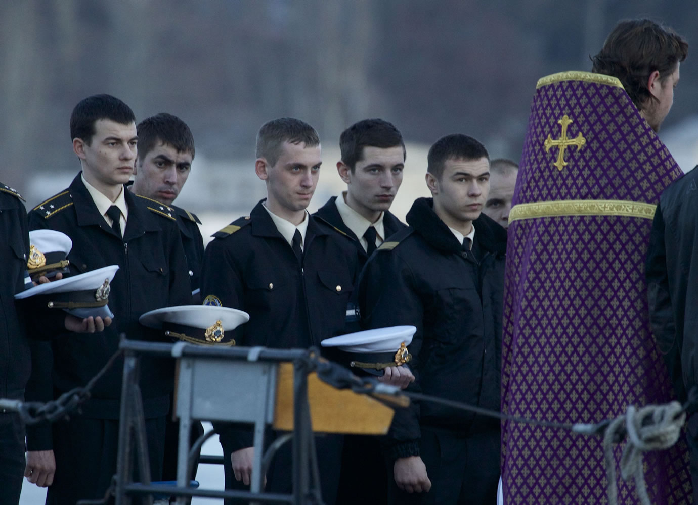 Crew members on the Ukrainian corvette Ternopil line up on deck Wednesday for a religious service conducted by an Orthodox priest, right, in Sevastopol, Ukraine, where Russian troops are in control.