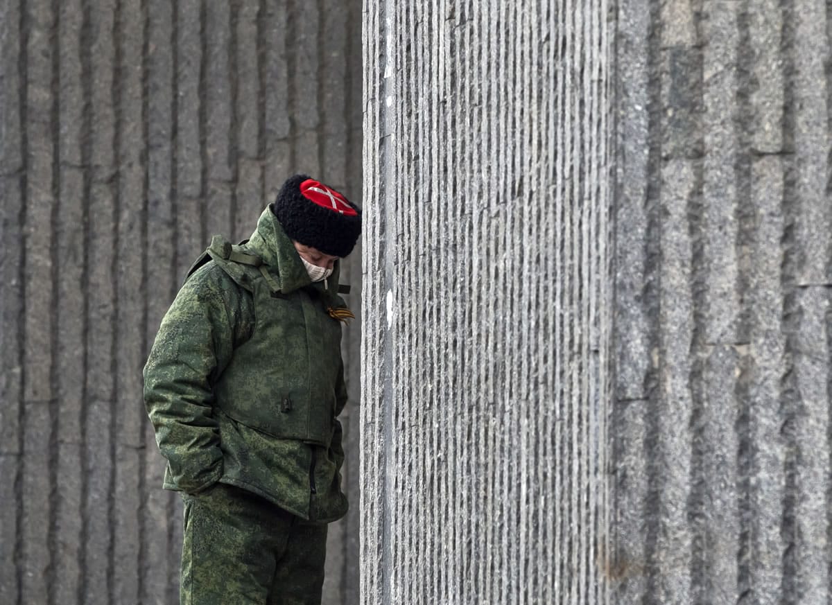 A Cossack guard stands outside of Crimea's regional parliament building in Simferopol, Ukraine, on Tuesday.