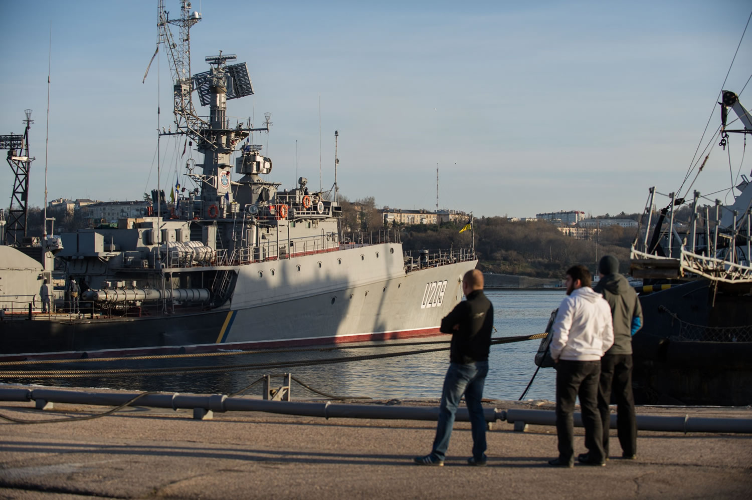 People look at Ukrainian navy ship Slavutich at harbor of Sevastopol, Ukraine, on Monday.