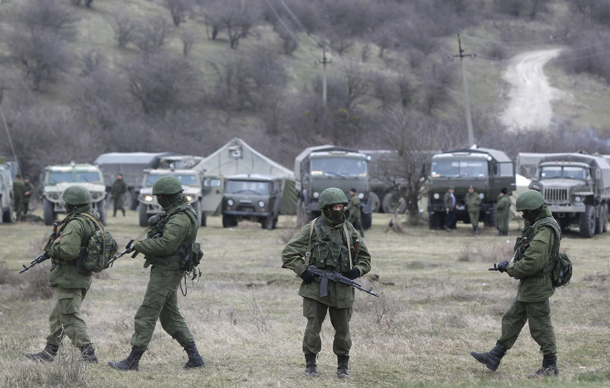 Pro Russian soldiers guard Ukraine's infantry base in Perevalne, Ukraine, on Tuesday.