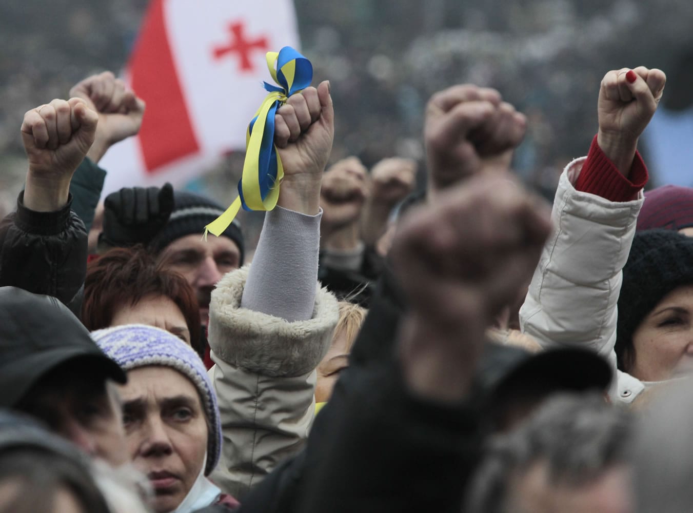 People shout slogans and gesture during a rally in Kiev's Independence Square on Sunday.