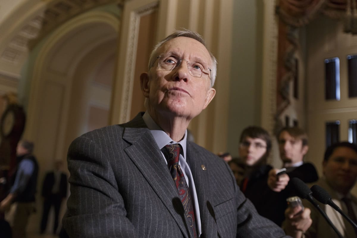 Senate Majority Leader Harry Reid tells reporters that he was pleased that six Republicans voted with the Democratic majority to proceed with legislation to renew jobless benefits for the long-term unemployed Tuesday at the Capitol in Washington.