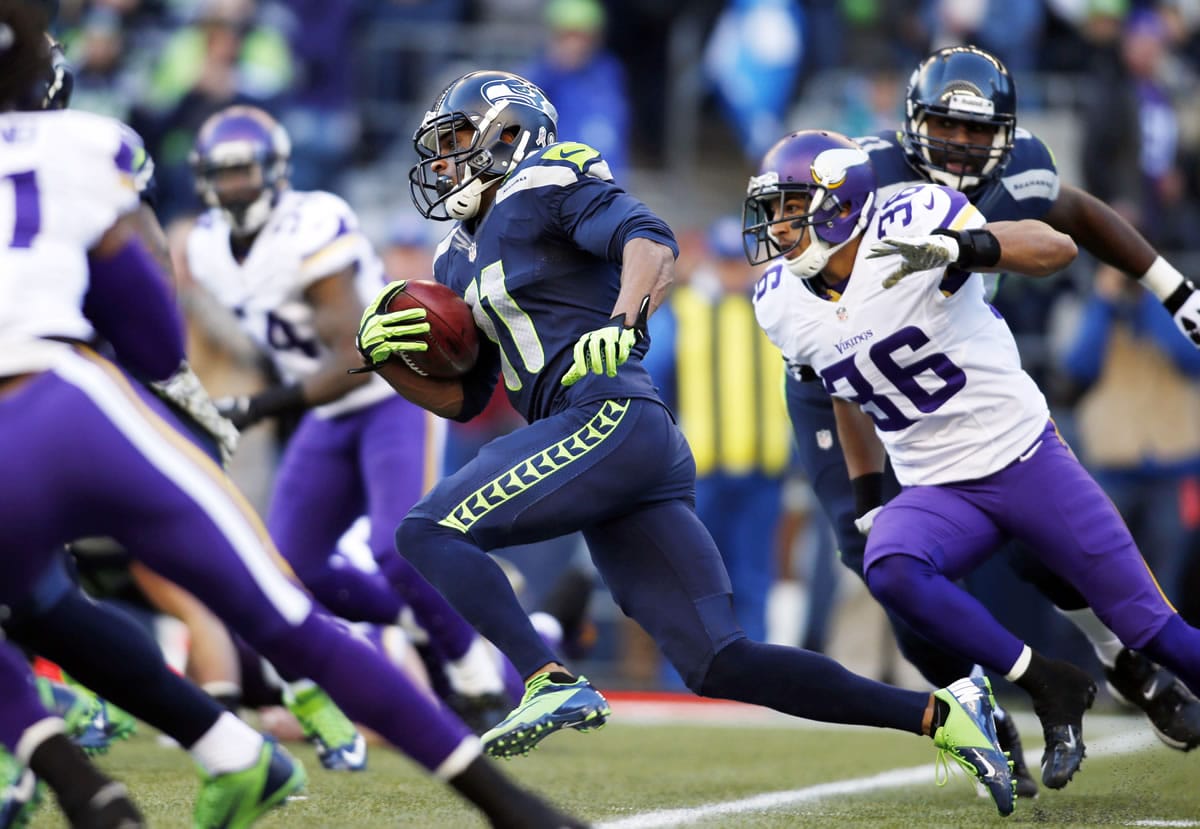Seattle Seahawks' Percy Harvin (11) returns the ball against the Minnesota Vikings on a kick off in the first half of an NFL football game Sunday, Nov.
