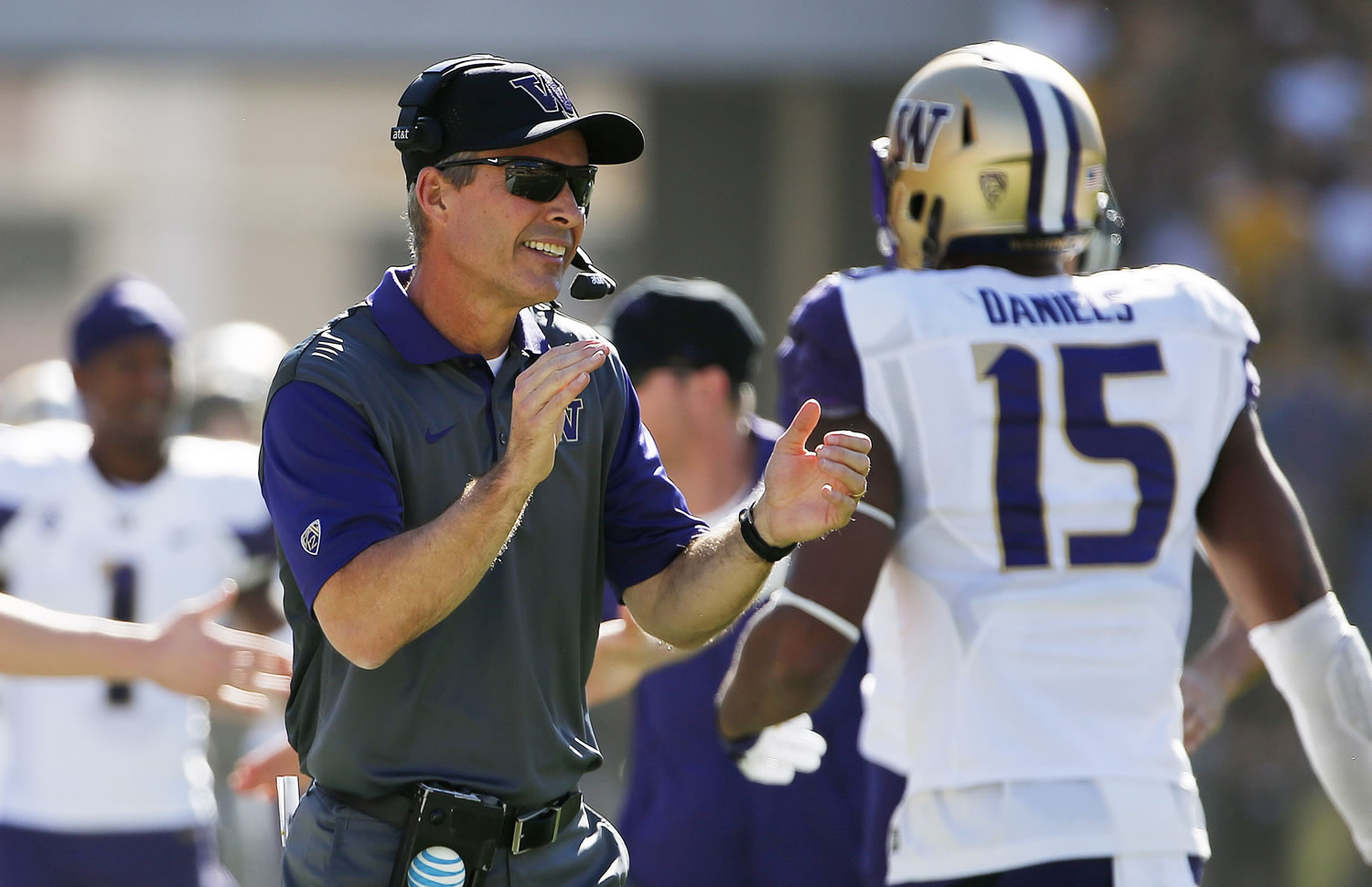 Washington head coach Chris Petersen applauds his players after a touchdown against Arizona State during the first half of an NCAA college football game Saturday, Nov. 14, 2015, in Tempe, Ariz. (AP Photo/Ross D.