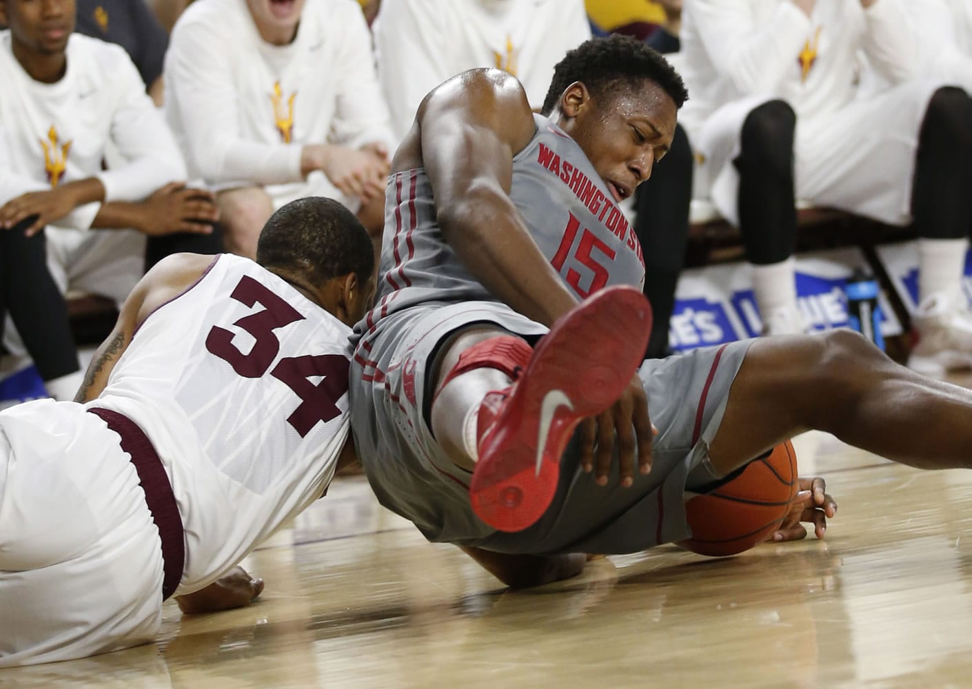 Arizona State guard Jermaine Marshall, left, and Washington State forward Junior Longrus scramble for the ball during the first half Sunday at Tempe, Ariz.