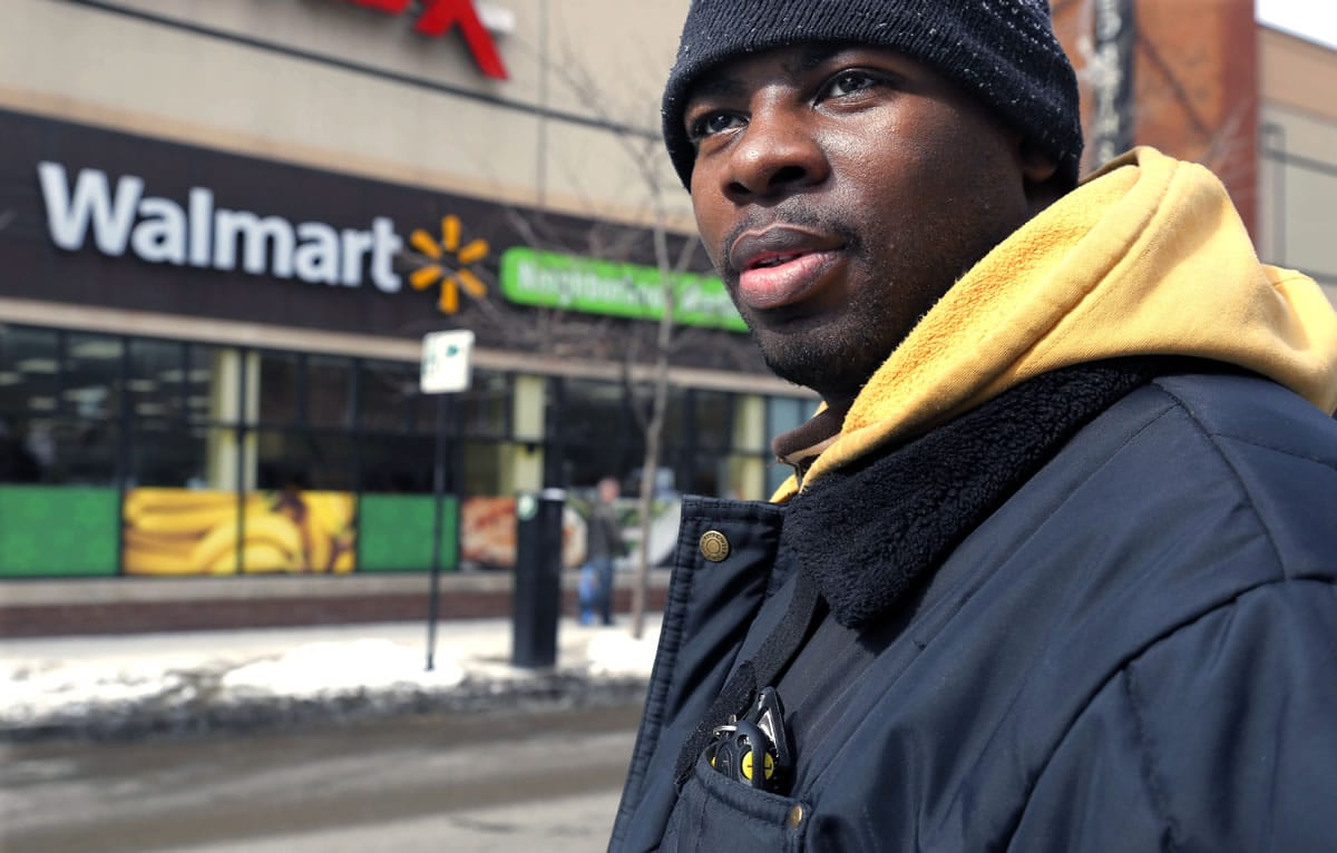 Wal-Mart employee Richard Wilson, 27, earns $9.45 an hour at the store he works at in Chicago. He left college without completing a degree, but with $50,000 in student debt.