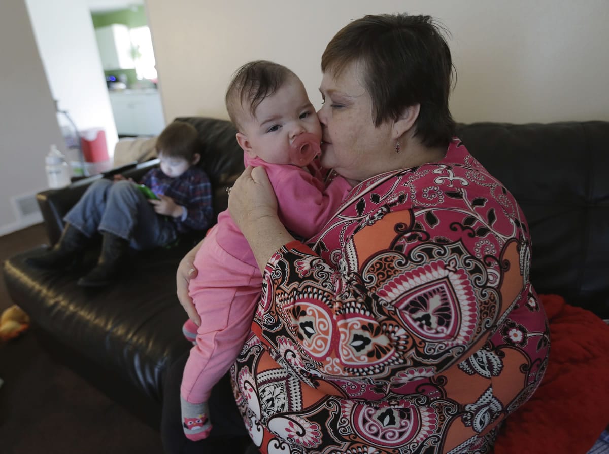 Mary-Jane Harrison plays with her granddaughter Feb. 3 in San Antonio.