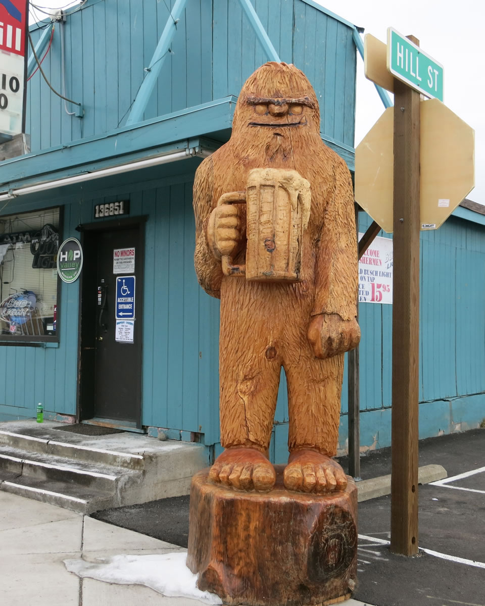 A beer-drinking Bigfoot stands outside the Bigfoot Tavern in Crescent, Ore.