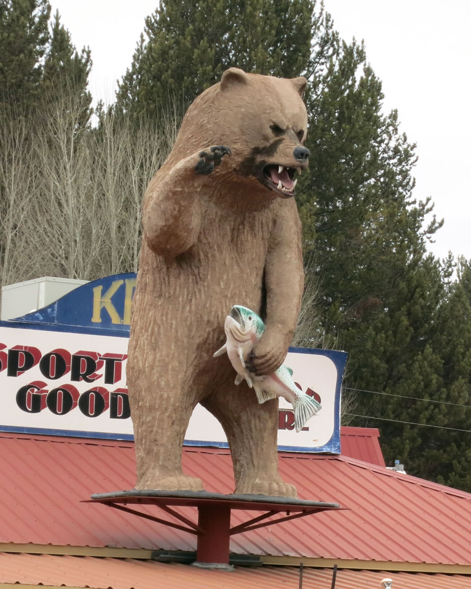 A fiberglass bear snarls atop Ken's Sporting Goods in Crescent, Ore., one of several such sculptures in town.