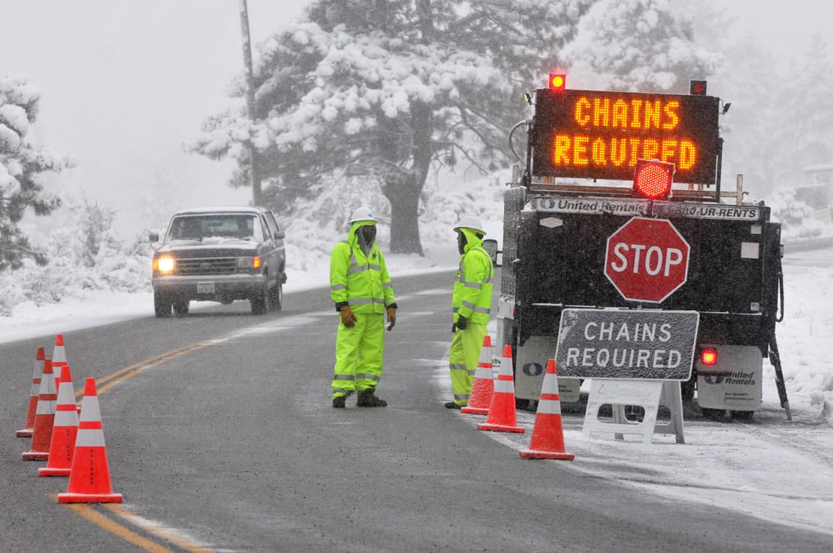 Caltrans set a up a chains required station just south of Mountain High Resort in Wrightwood, Calif, on Friday.