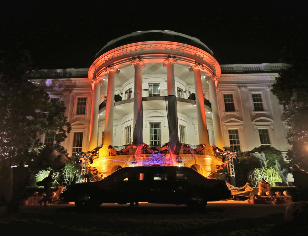 The South Portico of the White House is decorated and lit in orange lights in preparation of tomorrow's Halloween celebration on Wednesday, Oct. 30, 2013. President Barack Obama and first lady Michelle Obama will welcome local children and children of military families tomorrow to 'trick-or-treat'. The White House canceled its Halloween celebration last year in aftermath of Superstorm Sandy.