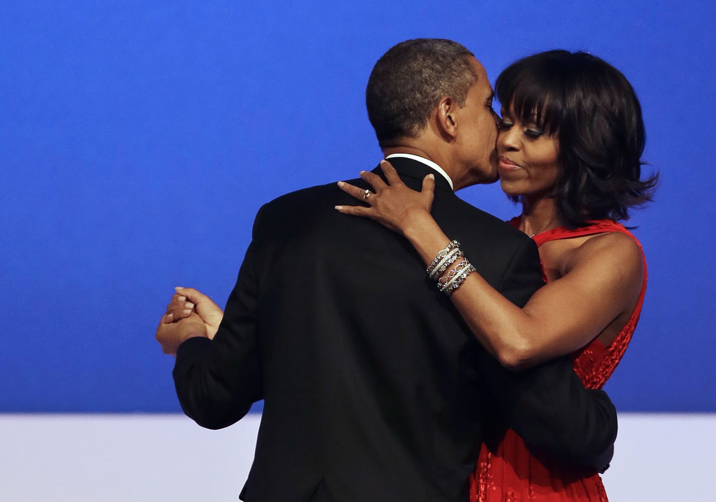 President Barack Obama kisses first lady Michelle Obama during their dance at the Commander-in-Chief Inaugural Ball at the Washington Convention Center in Washington on Jan.