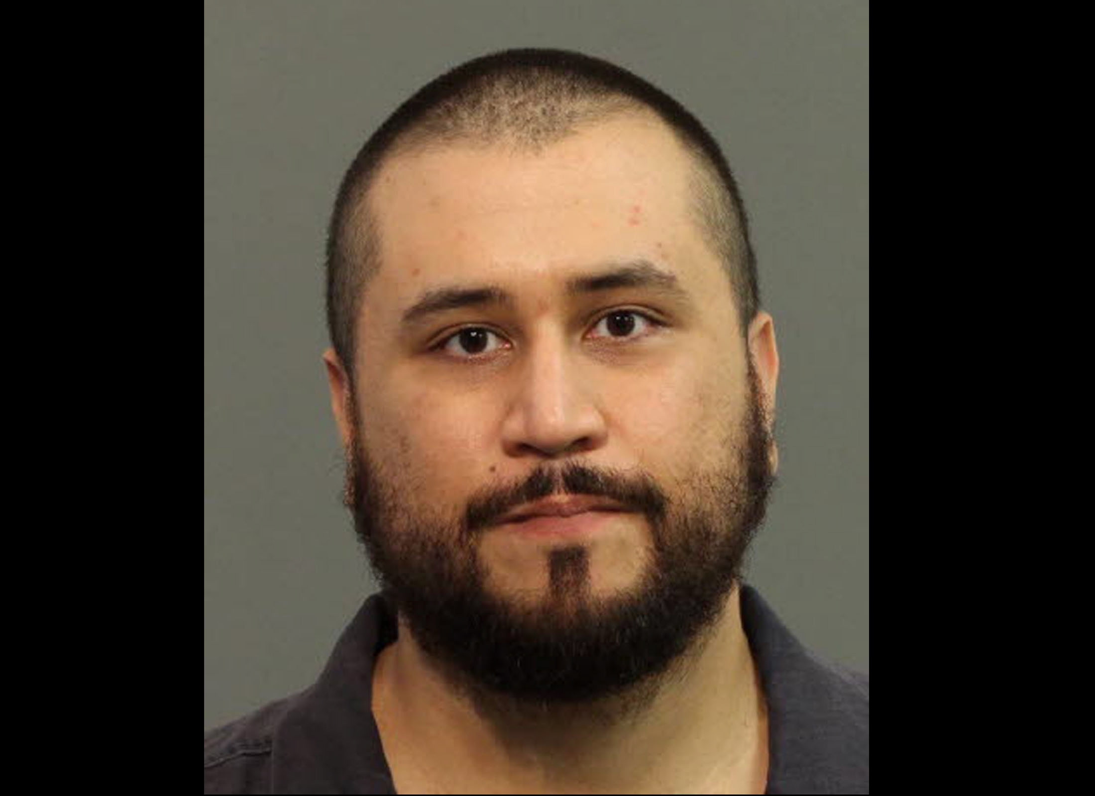 This image provided by the Seminole County Sheriff's Office shows former neighborhood watch volunteer George Zimmerman after he was arrested Monday in Apopka, Fla.