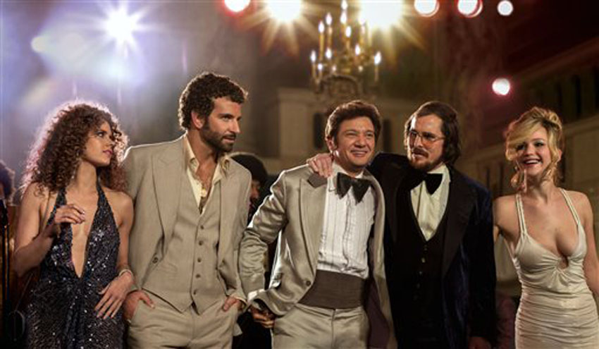 Amy Adams,from left, Bradley Cooper, Jeremy Renner, Christian Bale and Jennifer Lawrence in a scene from &quot;American Hustle.&quot;