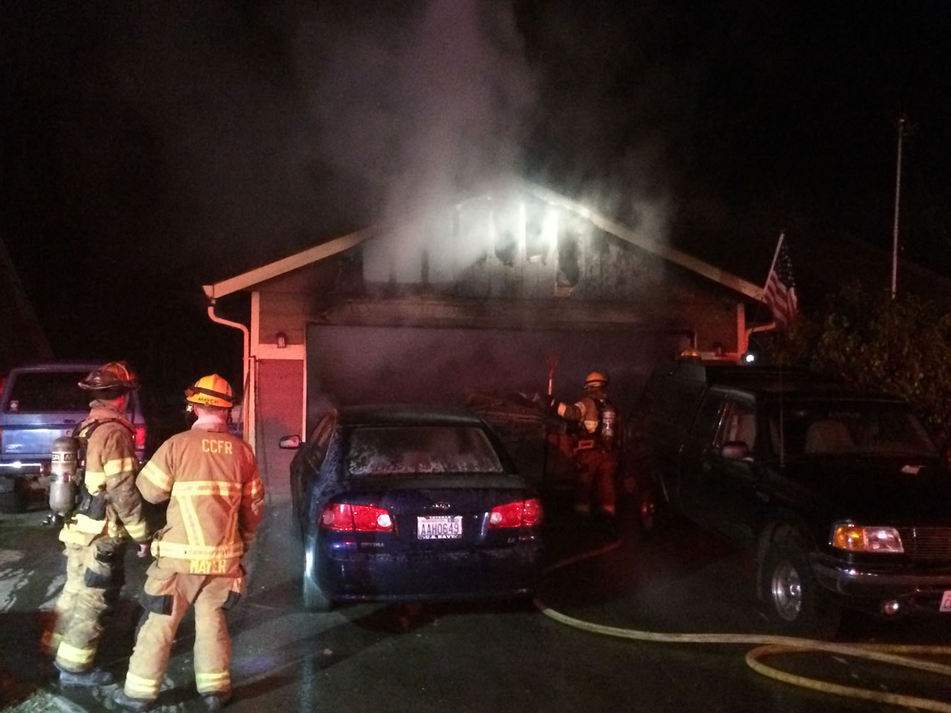 Three dogs were killed and a family of four was displaced in a fire Sunday night at a Battle Ground residence.