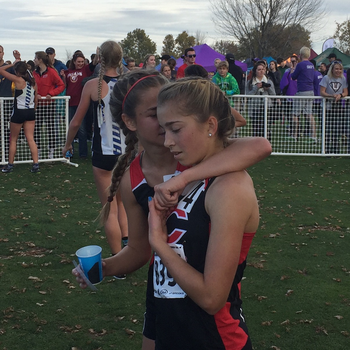 Camas runner Emily Wilson, left, congratulates teammate Rachel Blair, who finished fourth in the 4A state cross country championships Saturday in Pasco (Micah Rice/The Columbian)