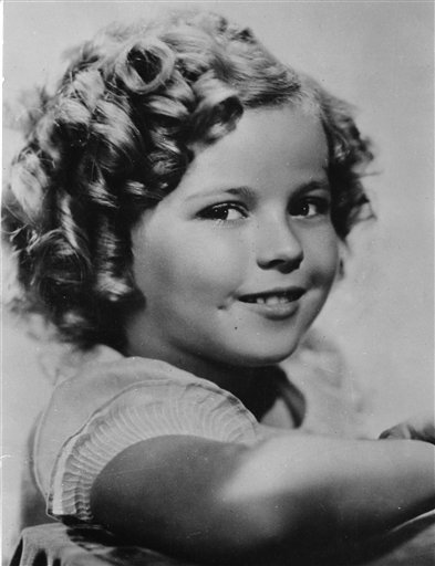 In this Nov. 1936 file photo, 8-year-old U.S. American child movie star Shirley Temple is portrayed in Hollywood, Ca., USA. Shirley Temple, the curly-haired child star who put smiles on the faces of Depression-era moviegoers, has died. She was 85. Publicist Cheryl Kagan says Temple, known in private life as Shirley Temple Black, died surrounded by family at her home near San Francisco.