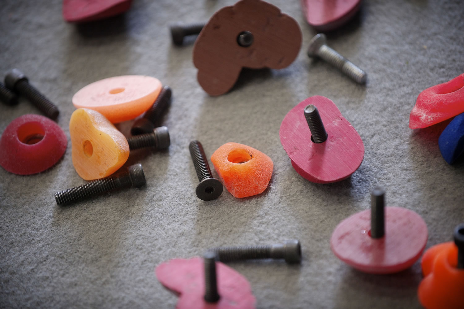 Climbing holds come in a variety of  shapes, sizes and textures, meant to represent climbing sites around the world.