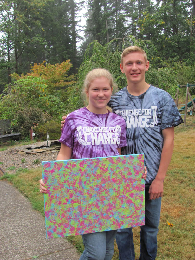 Post-Record file photo
Chloe and Carson Connors hold a painting she created, called &quot;Hope,&quot; which was sold in a silent auction to raise money for the Teen Challenge Metro Men's Center. The two hosted a &quot;Challenge for Change,&quot; event in honor of their brother, who overcame a heroin addiction.