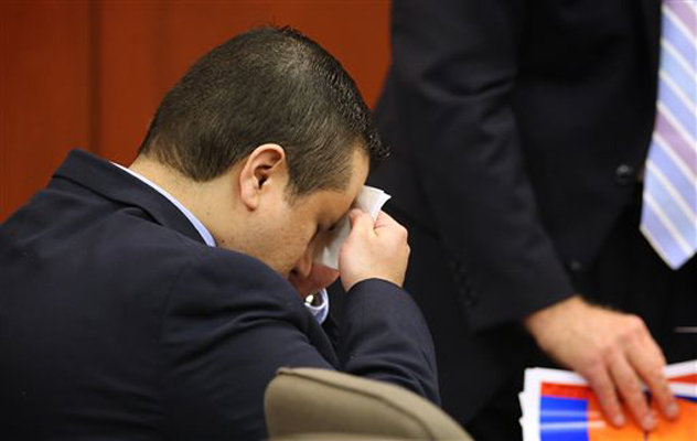 George Zimmerman wipes his face after arriving in the courtroom for his trial at the Seminole County Criminal Justice Center, in Sanford, Fla., Friday, July 12, 2013.