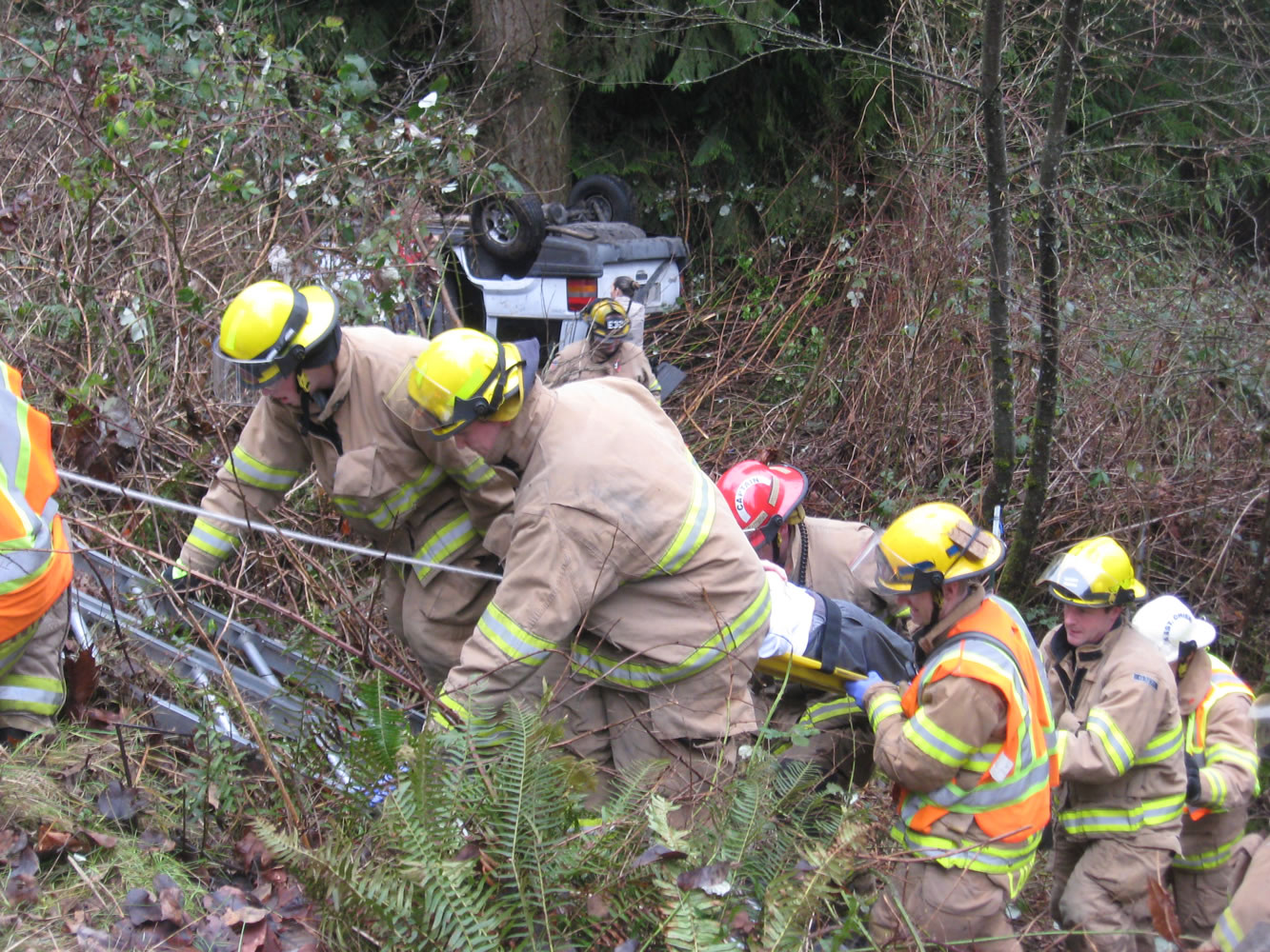 Firefighters rescue a 17-year-old girl who was injured when her vehicle left the roadway and landed upside-down in an embankment in Hockinson.