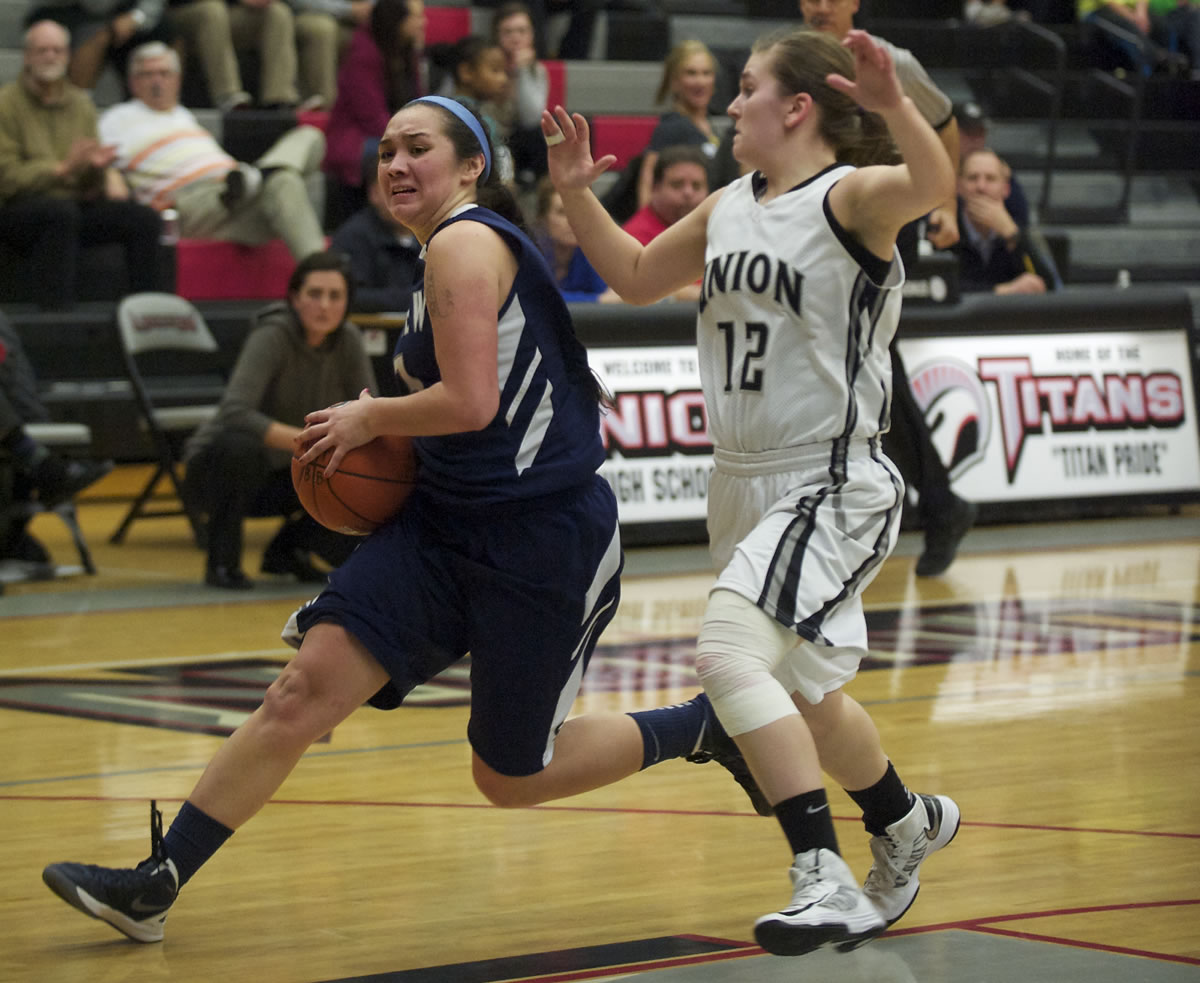 Skyview's Stephanie McDonagh steps around  Union's Kendra Preuninger in the first half of a 4A GSHL match-up at Union on Thursday January 31, 2013.