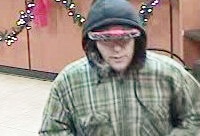 A bank surveillance camera captured this image of the &quot;Elmer Fudd&quot; bank robber when he struck  at a US Bank branch at on Southeast McGillivray Boulevard on Dec.