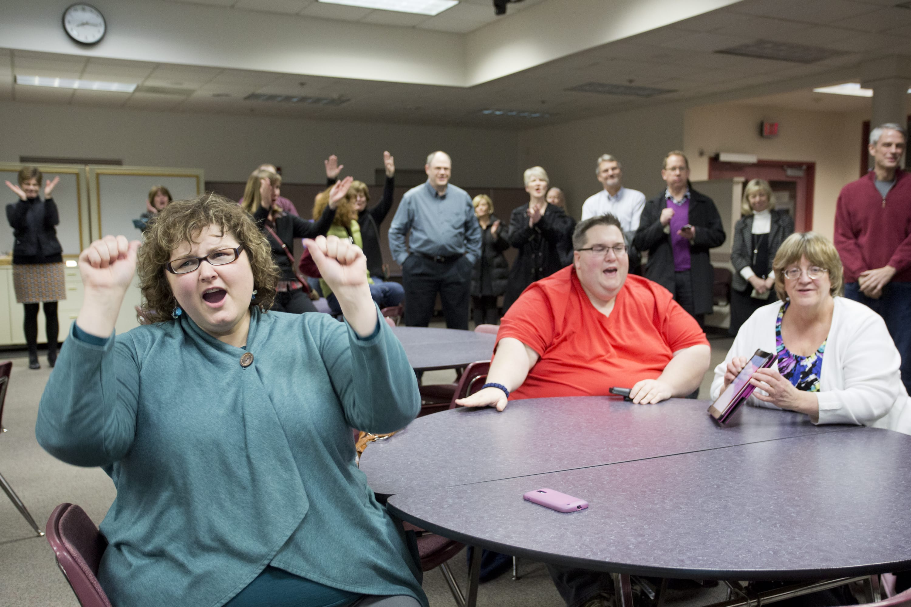 Leslie Morrison, left, a Vancouver Public Schools special education teacher with the GATE Program, reacts to election results, along with other teachers and board members, Tuesday evening.