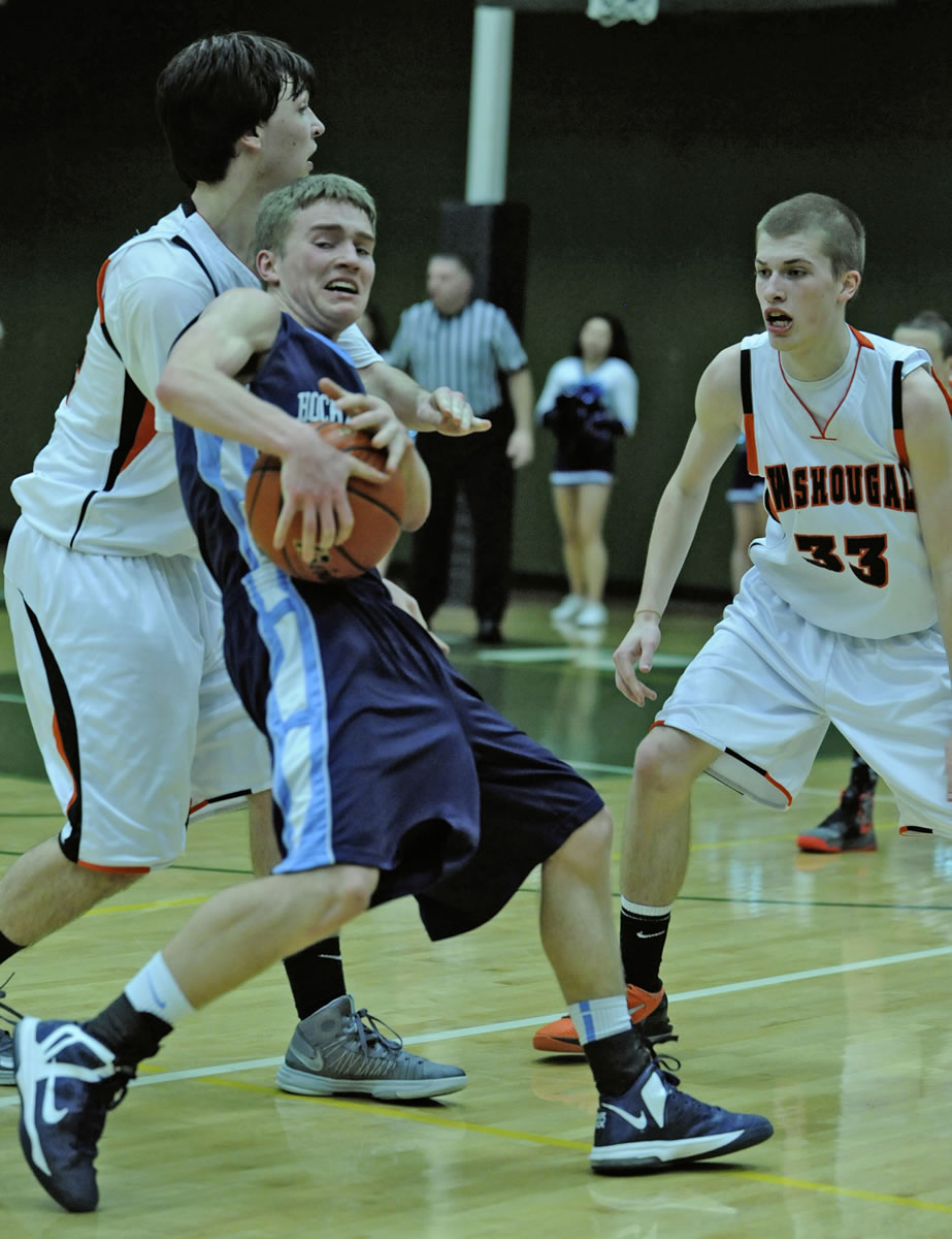 Greg Wahl-Stephens/For The Columbian
Washougal's Aaron Deister, left, battles against Hockinson's Alan Haagen during the Hawks' victory in a district playoff game.