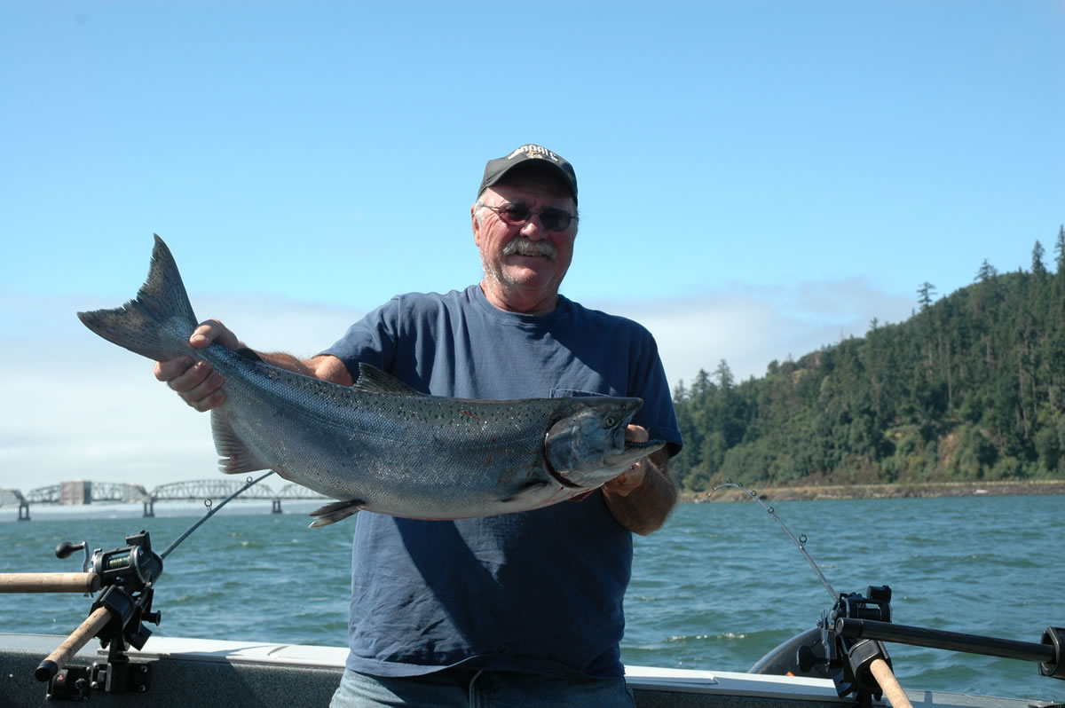 Gary Baker of Olympia holds a fall chinook caught a short distance upstream of the Astoria Bridge in the Buoy 10 fishery.