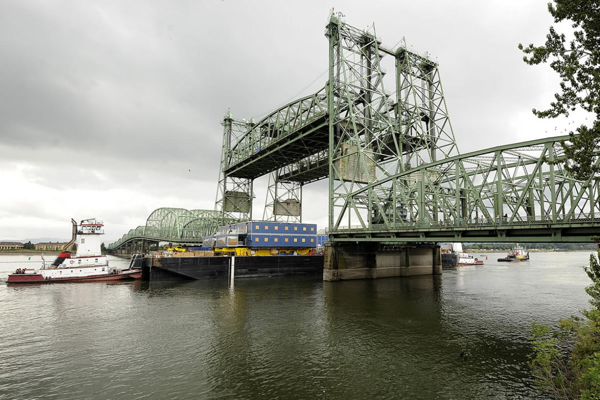 A section of a huge drilling rig goes under the Interstate 5 Bridge in July 2009 on its way to Alaska's North Slope.
