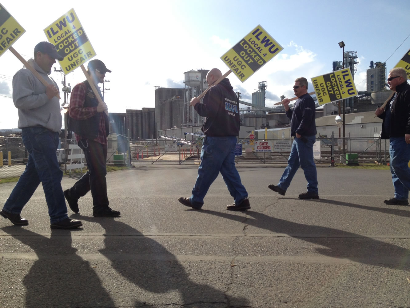 United Grain dockworkers picket Sunday afternoon, the sixth day of United Grain's lockout of 44 workers in their dispute over working rules outlined in an offered contract.